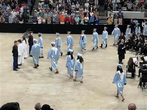 students from James Clemens in caps and gowns in lineup